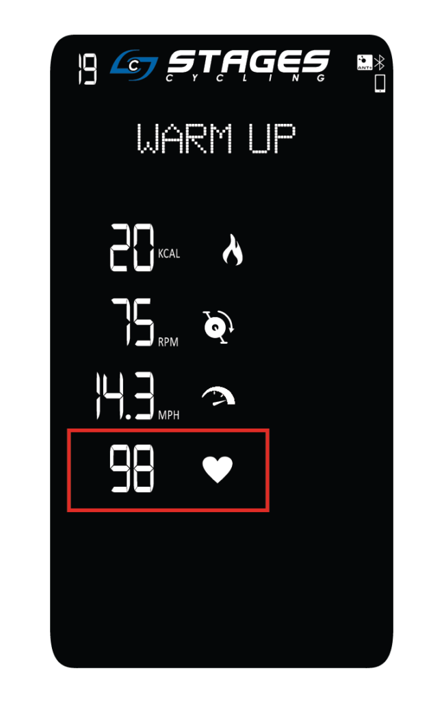 Pantalla de calentamiento que muestra calorías, cadencia y frecuencia cardíaca con un cuadro rojo alrededor de la frecuencia cardíaca.